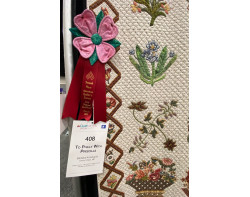 To Philly With Priscilla by Barbara Korengold - Second Place Ribbon and Sign (Photo by Ricky Tims from AQS QuiltWeek Paducah 2023)
