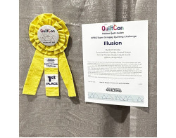 Illusion by Beth Shutty - First Place Supper Scrappy Quilting Challenge Ribbon and Sign (Photo from allpeoplequilt Instragram Page)
