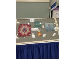 Scandinavian Summer by Barbara Kilbourn - On View in Display Case at AQS QuiltWeek Paducah 2025 (Second Angle)