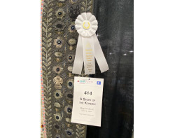 A Story Of The Kokeshi by Megumi Mizuno - Honorable Mention Ribbon and Sign (Photo by Ricky Tims from AQS QuiltWeek Paducah 2023)