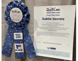 Subtle Secrets by Felicity Ronaghan and Others - First Place Group or Bee Quilts Ribbon and Sign (Photo from Canadian Mod Quilt Collective Facebook Page)