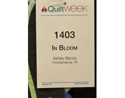 In Bloom by Ashley Bandy - AQS QuiltWeek Paducah 2025 Sign