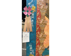 Harlequinade by Beckey Prior, Quilted by Jackie Brown - Ribbon and Sign (Photo by Rick Tims from AQS QuiltWeek Paducah 2023)