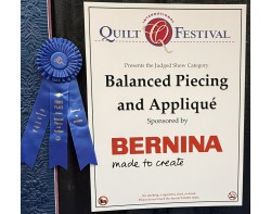 Balanced Piecing and Applique Sign at Houston International Quilt Festival 2025