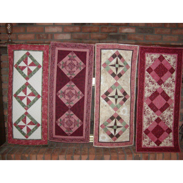 Rose colored wedding table runners