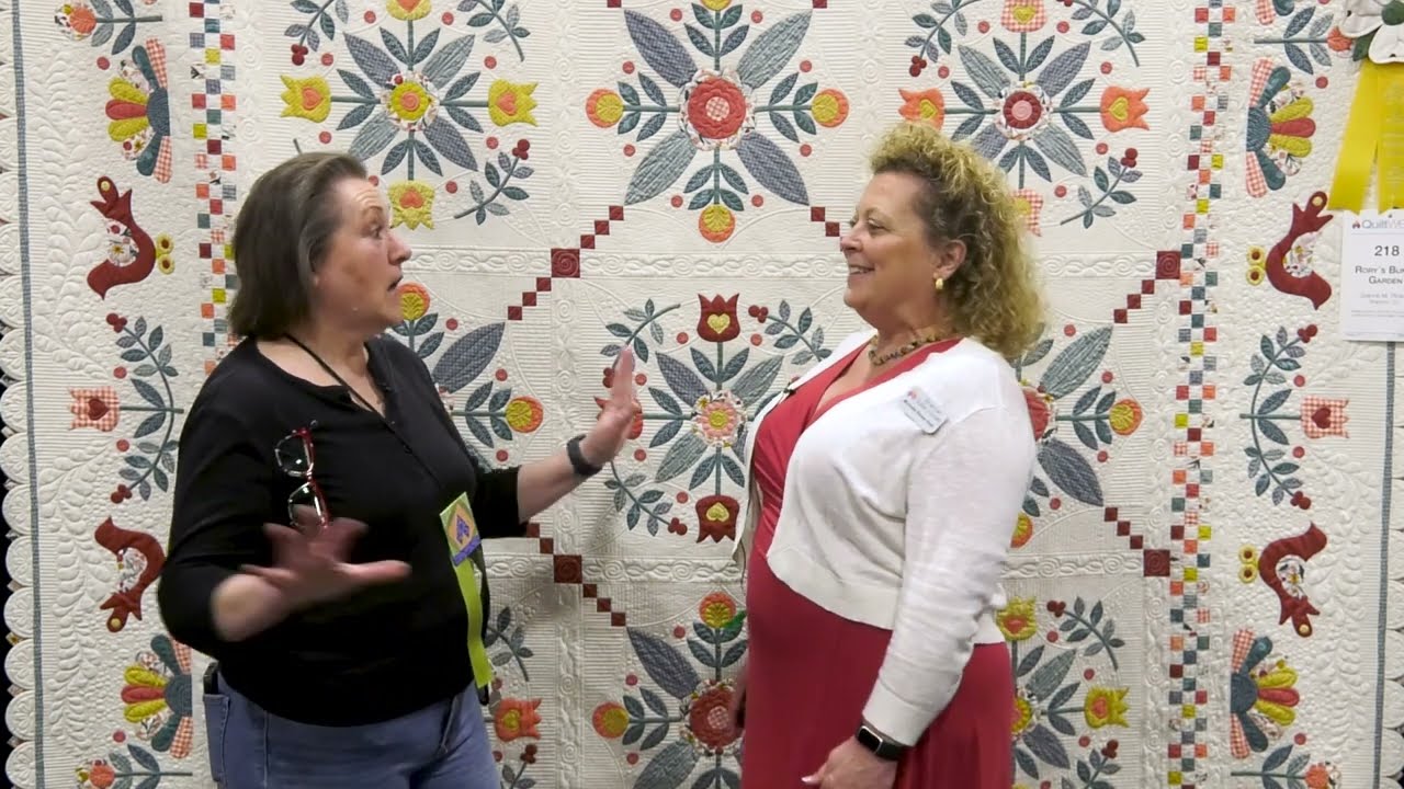 Joanne M. Pickett Speaks with Michelle Renee Hiatt about &quot;Rory&#039;s Bunny Garden,&quot; Winner of the Third Place Award in the Large Quilts - Movable Machine Quilted Category at AQS QuiltWeek - Paducah 2025